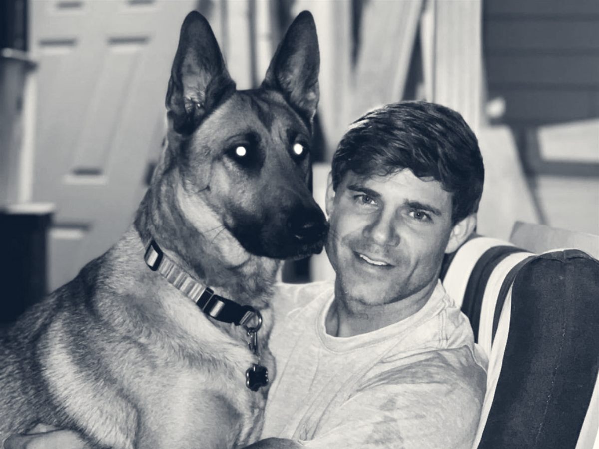 Zoey, the family German shepherd, with Drew